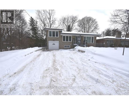 A snow-covered house with a sign that says "REALTOR" in the background.
