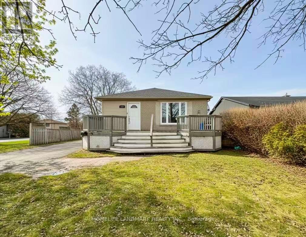A house with a front porch and a driveway.