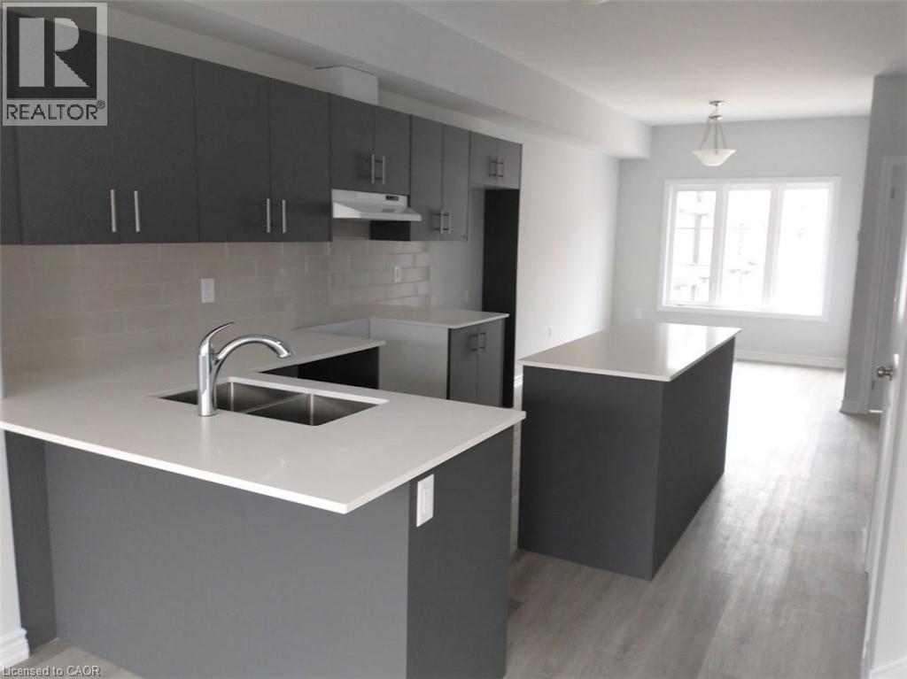 A modern kitchen with a sink and cabinets.