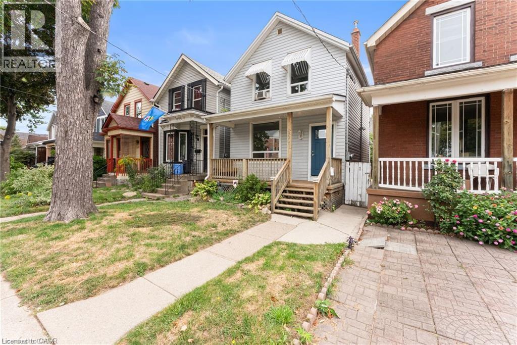 A house with a blue door and a porch.