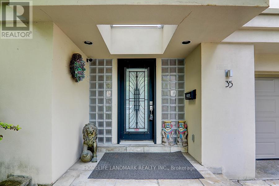 A house entrance with a glass door and a stone lion statue.