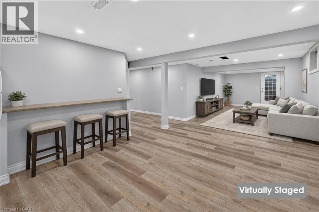 A living room with a bar area and a couch.
