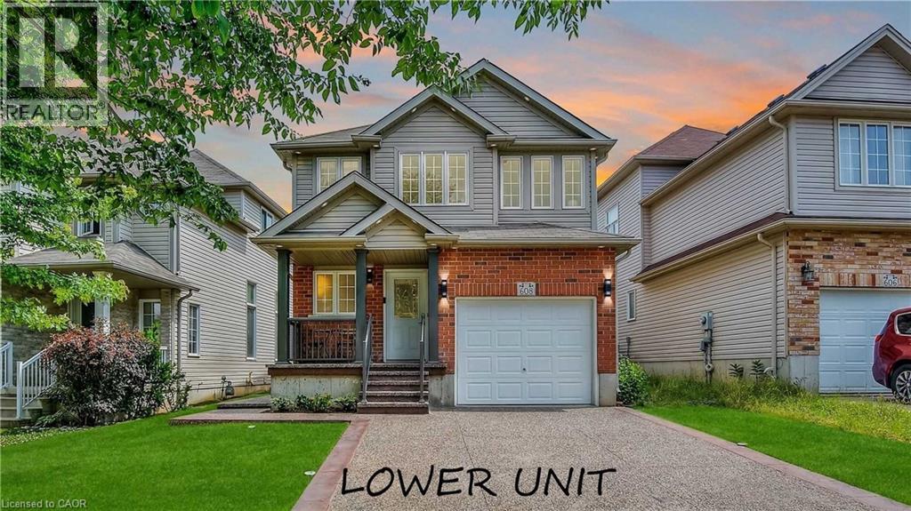A house with a driveway in front and a sign that says "LOWER UNIT".