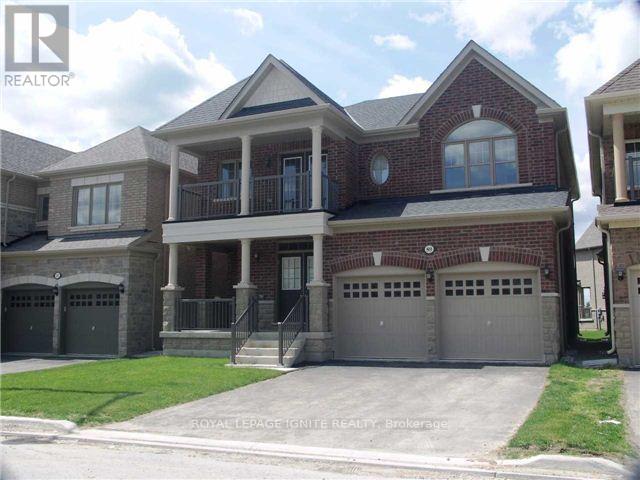 A large brick house with a garage is for sale.