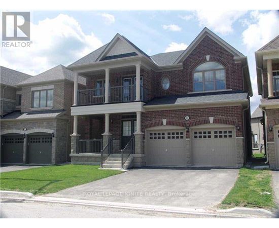A large brick house with a garage is for sale.