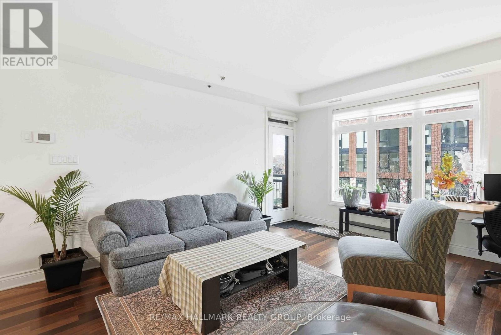 A living room with a grey sofa and a coffee table.