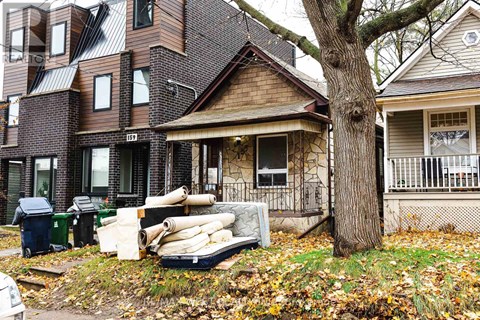 A house with a tree in front of it.