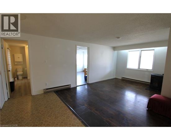 A living room with a couch and a television.
