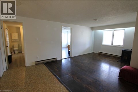 A living room with a couch and a television.