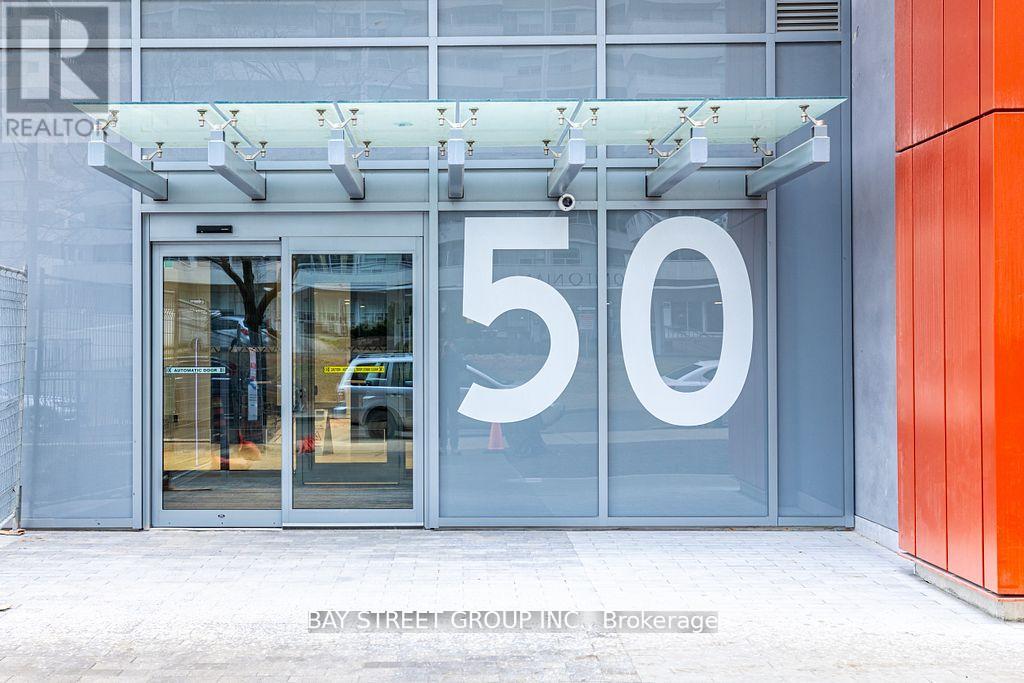 The entrance to a building with a glass door and a number 50 on it.