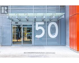 The entrance to a building with a glass door and a number 50 on it.