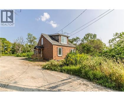 A house with a driveway in front of it is for sale.