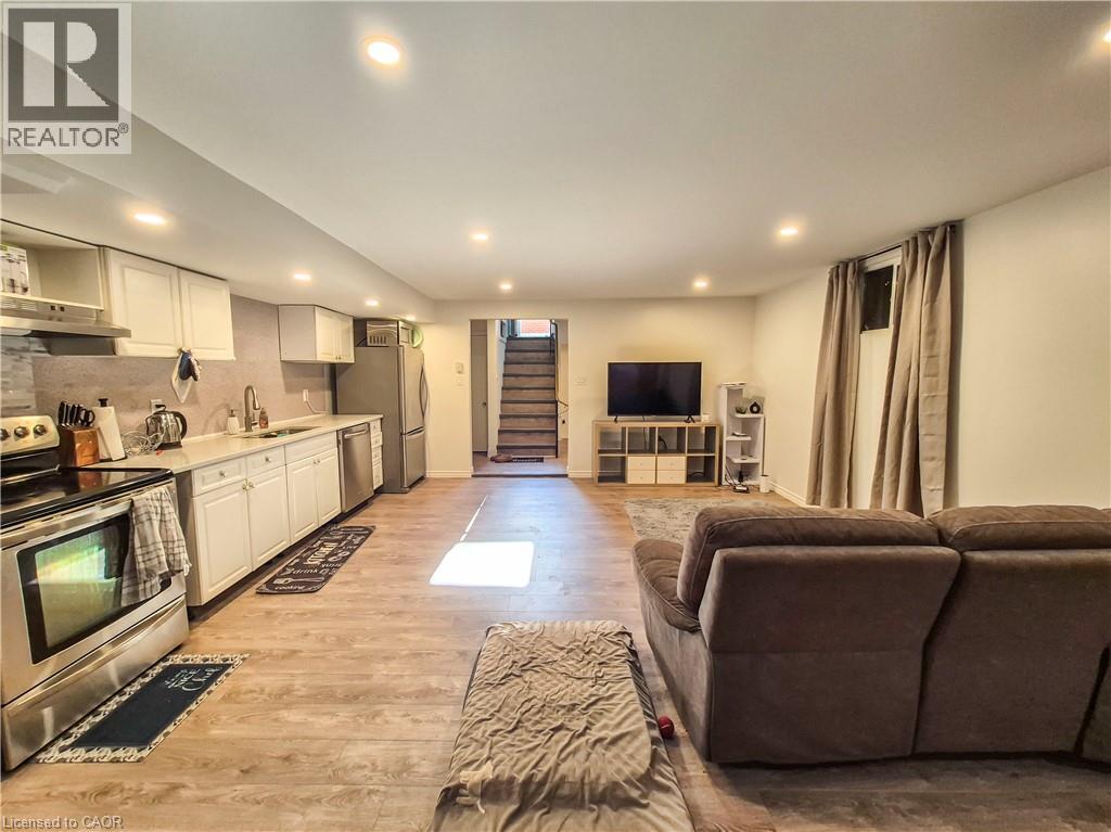 A modern kitchen with a stainless steel stove and a large island.