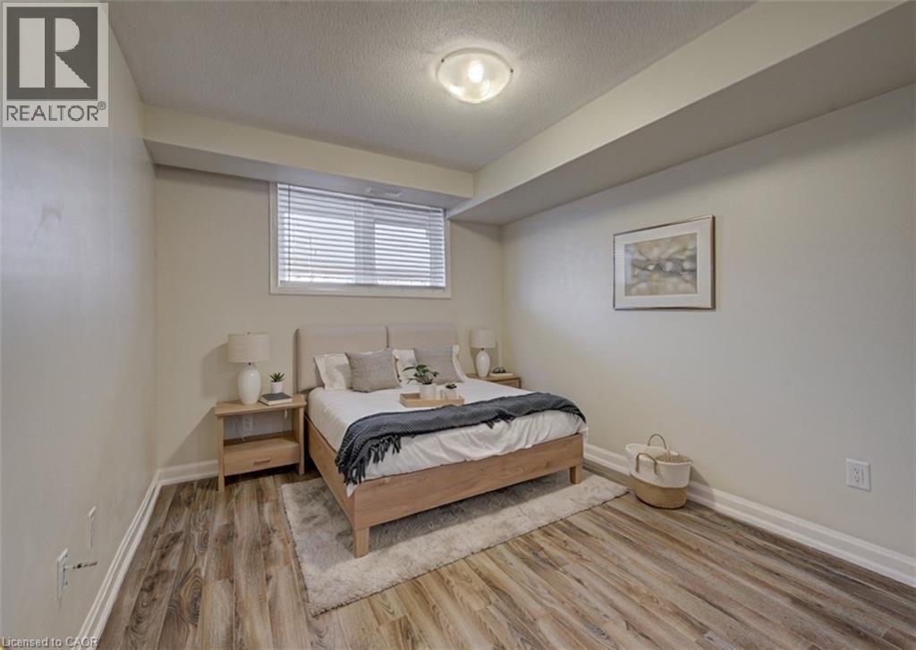 A bedroom with a bed, nightstands, and a rug.