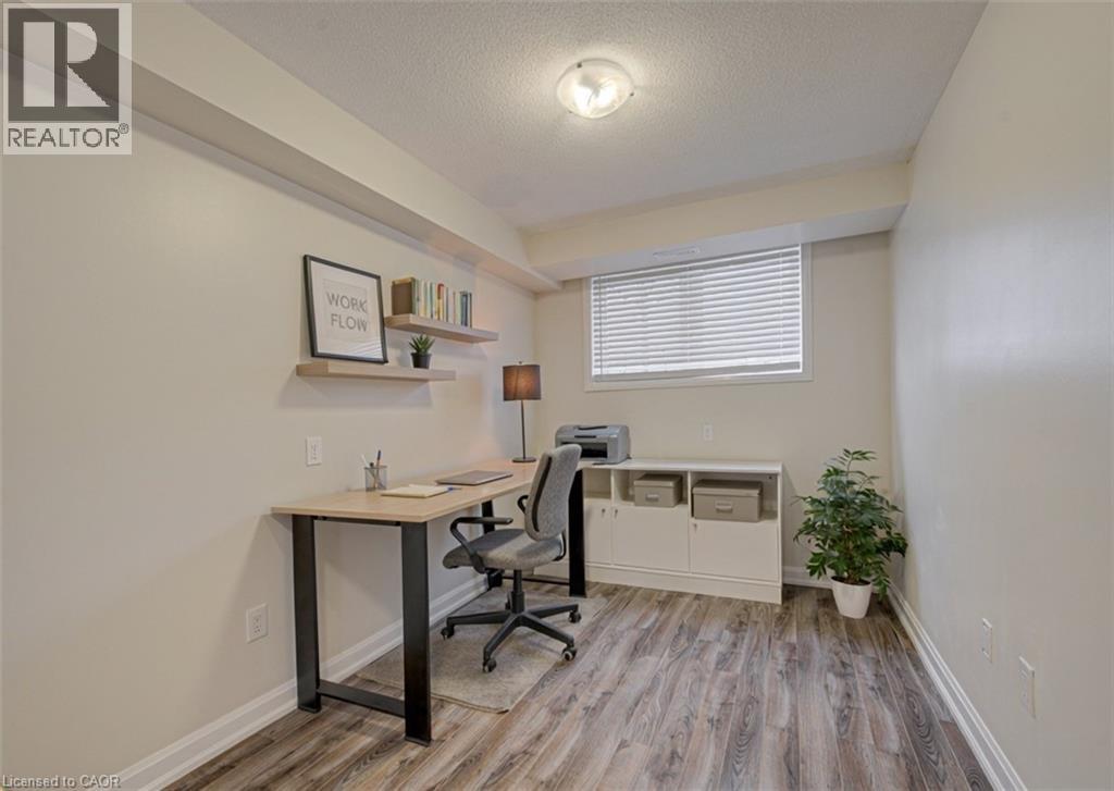 A room with a desk and a chair.