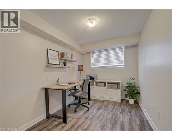 A room with a desk and a chair.