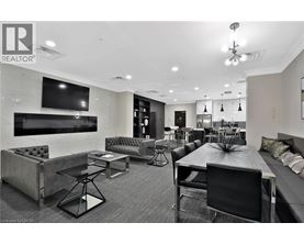 A modern living room with a black and white color scheme.