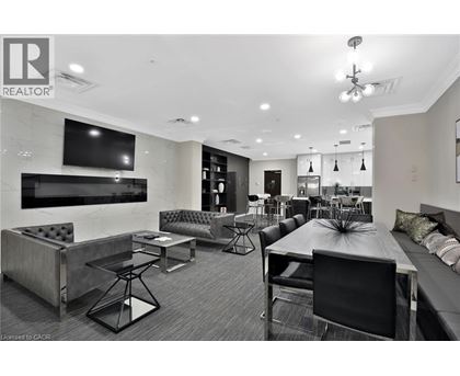A modern living room with a black and white color scheme.