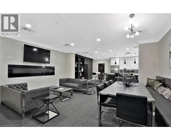 A modern living room with a black and white color scheme.