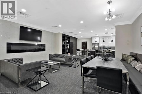 A modern living room with a black and white color scheme.