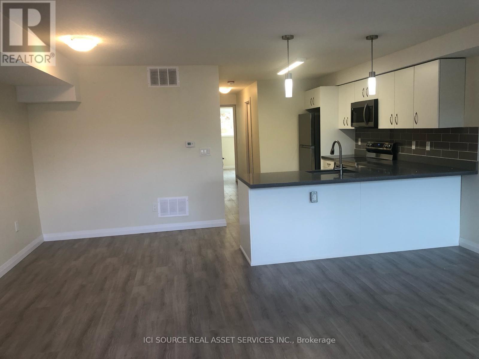 A kitchen with a counter and cabinets.