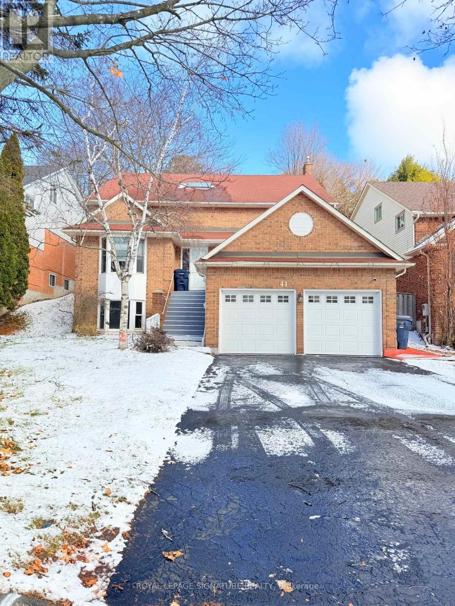 A house with a driveway in front of it.