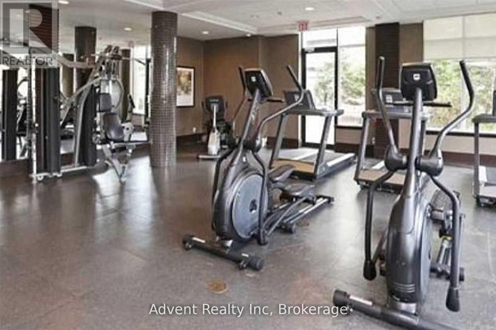 A gym with treadmills, elliptical machines, and other cardio equipment.