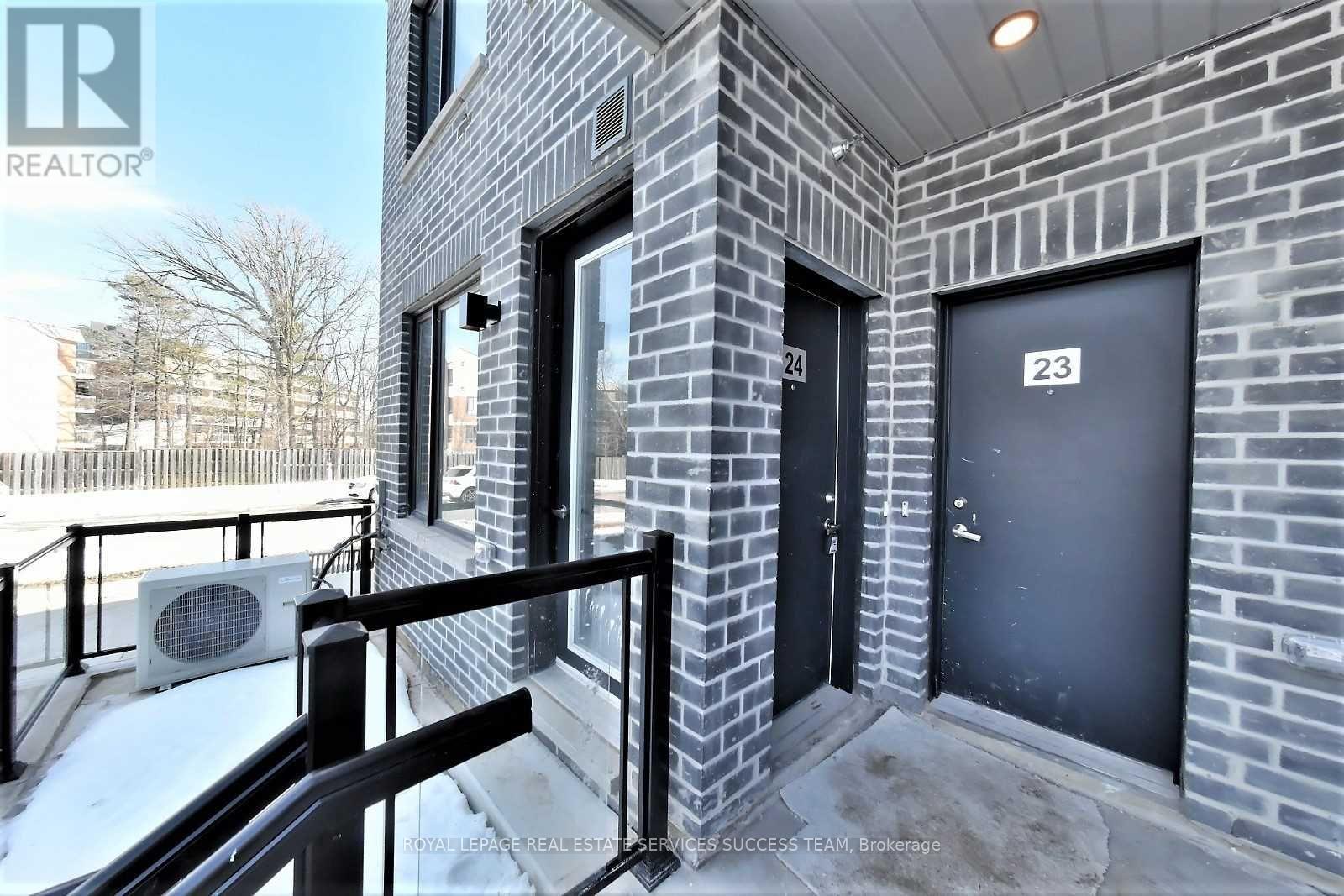 A building with the number 23 on the door.