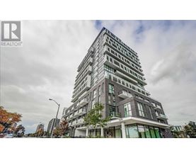 A tall residential building with a modern design is shown in the image.