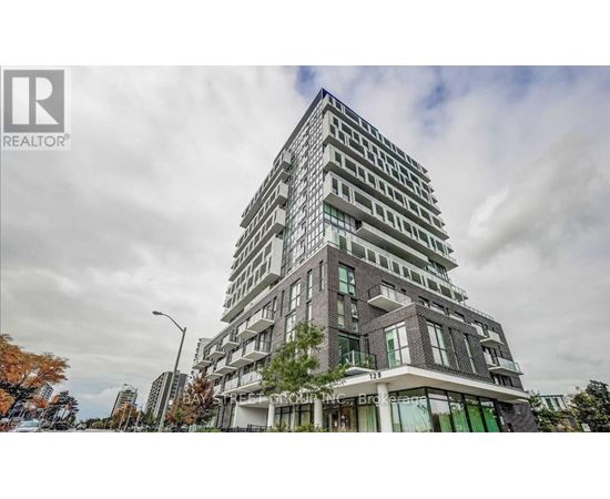 A tall residential building with a modern design is shown in the image.