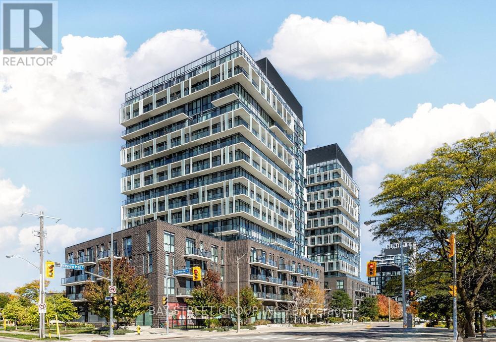 A tall building with many windows is in the foreground of the image.
