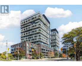 A tall building with many windows is in the foreground of the image.