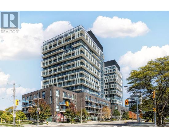 A tall building with many windows is in the foreground of the image.