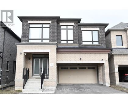 A modern two-story house with a garage is for sale.