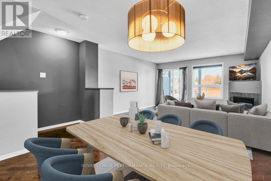 A modern dining room with a wooden table and blue chairs.