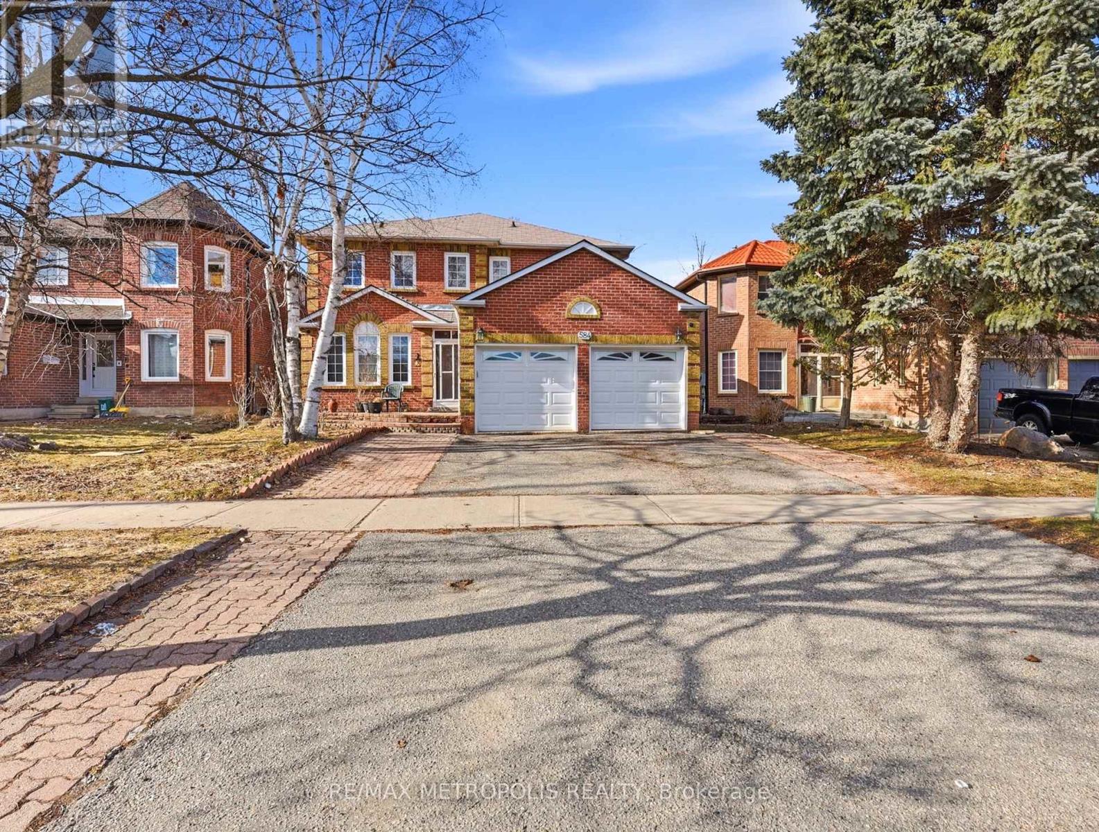 A residential area with houses and driveways.