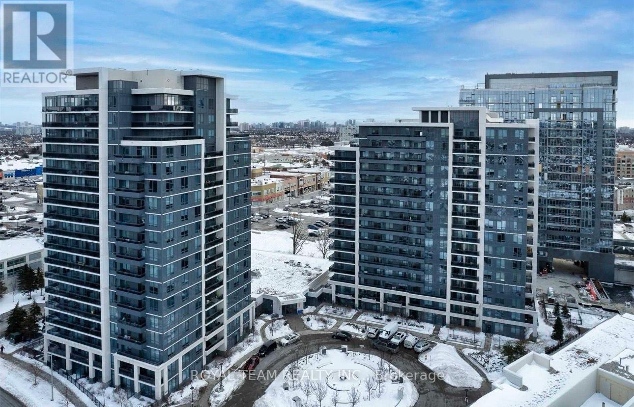 A realtor logo is displayed on a building in a snowy city.