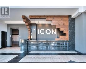 A modern interior space with a staircase and a reception desk.