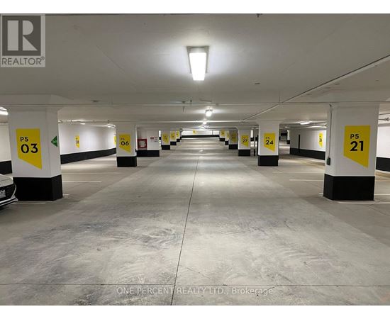 A parking garage with numbered parking spaces.