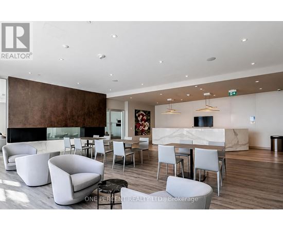 A modern living room with a fireplace and a dining table set up.
