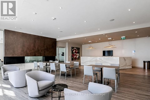 A modern living room with a fireplace and a dining table set up.