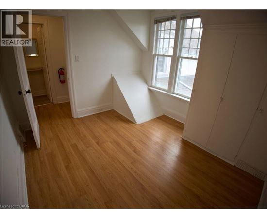 A room with wooden floors and white walls.