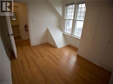 A room with wooden floors and white walls.