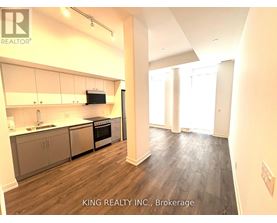 A kitchen with a stove top oven and a microwave built into the cabinetry.