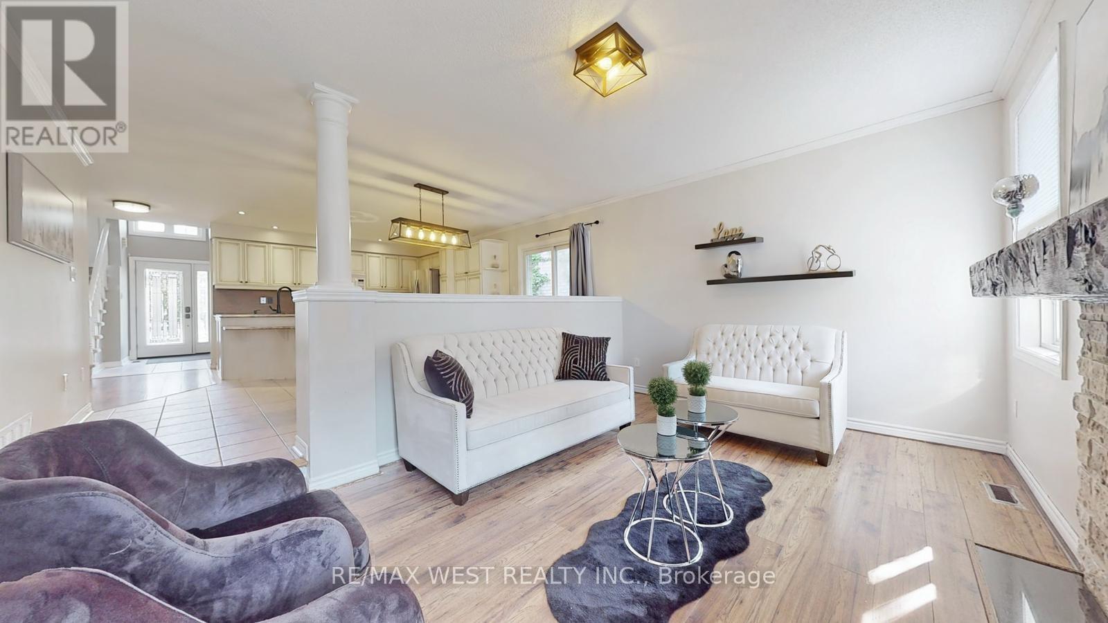 A living room with a white couch and a coffee table.