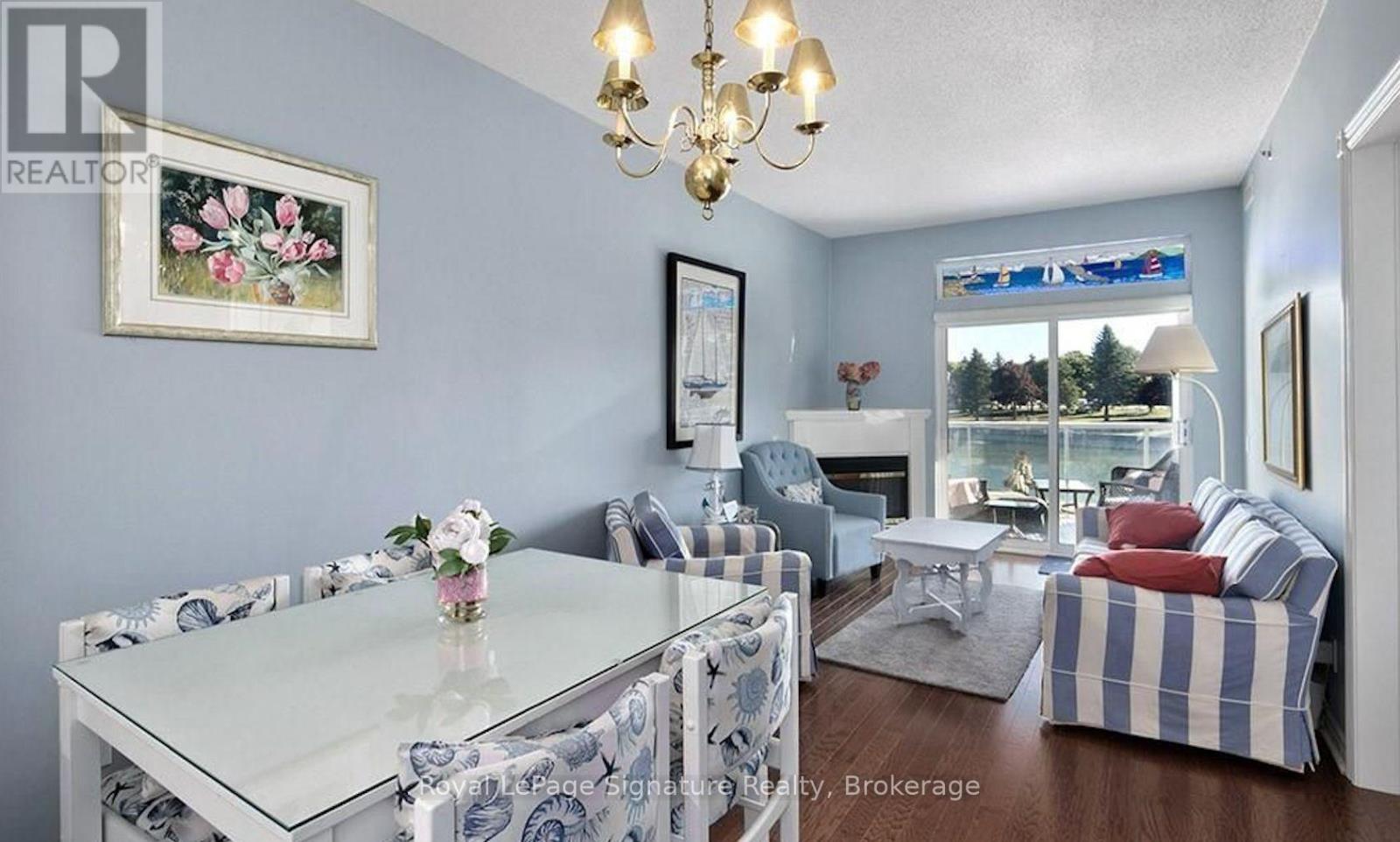 A living room with a glass table and chairs.