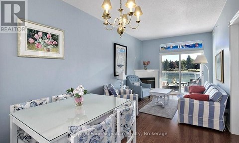 A living room with a glass table and chairs.