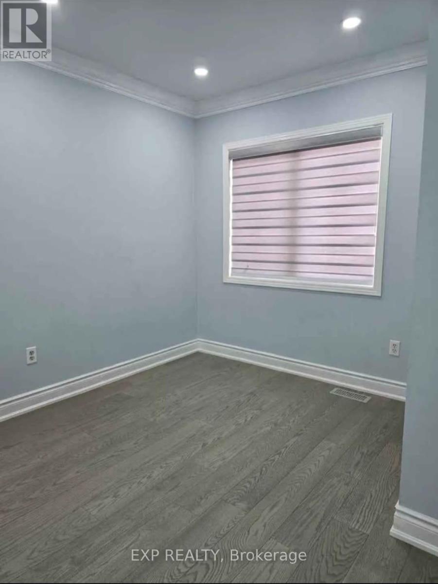 A room with a window covered in pink blinds.