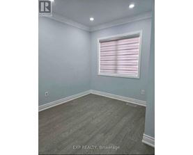 A room with a window covered in pink blinds.