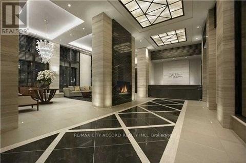 A spacious lobby with a black and white checkered floor.